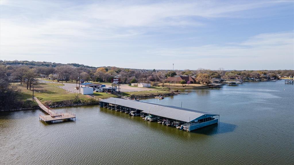 an aerial view of a house with lake view