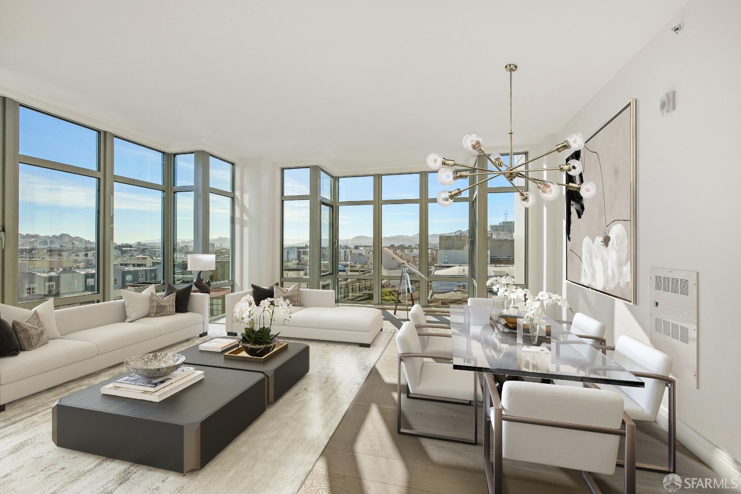 a living room with furniture and floor to ceiling windows