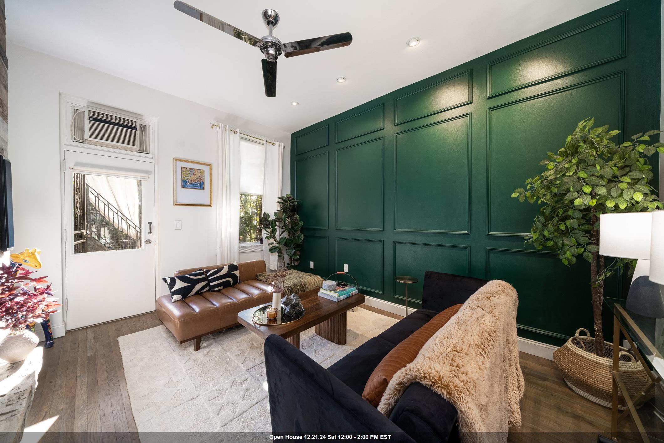 a living room with furniture gym equipment and a chandelier