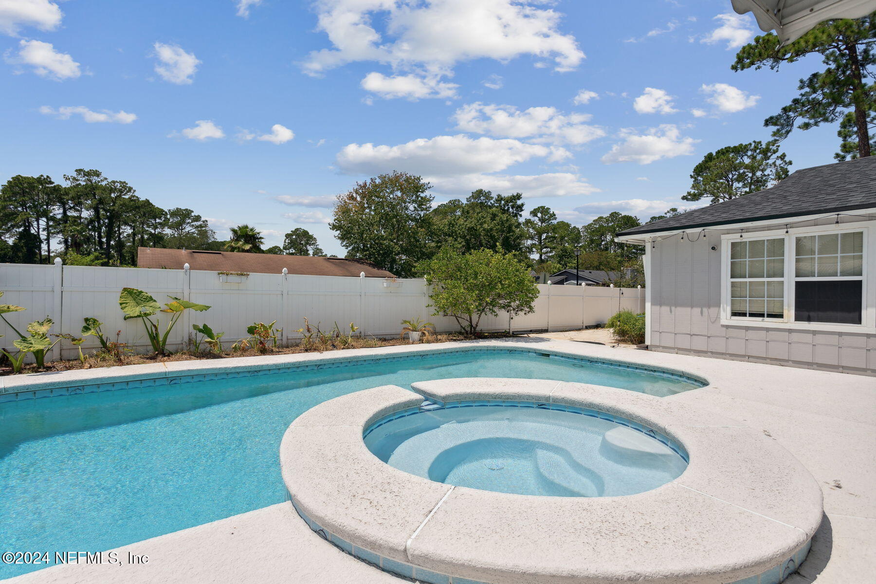 a view of swimming pool with outdoor seating