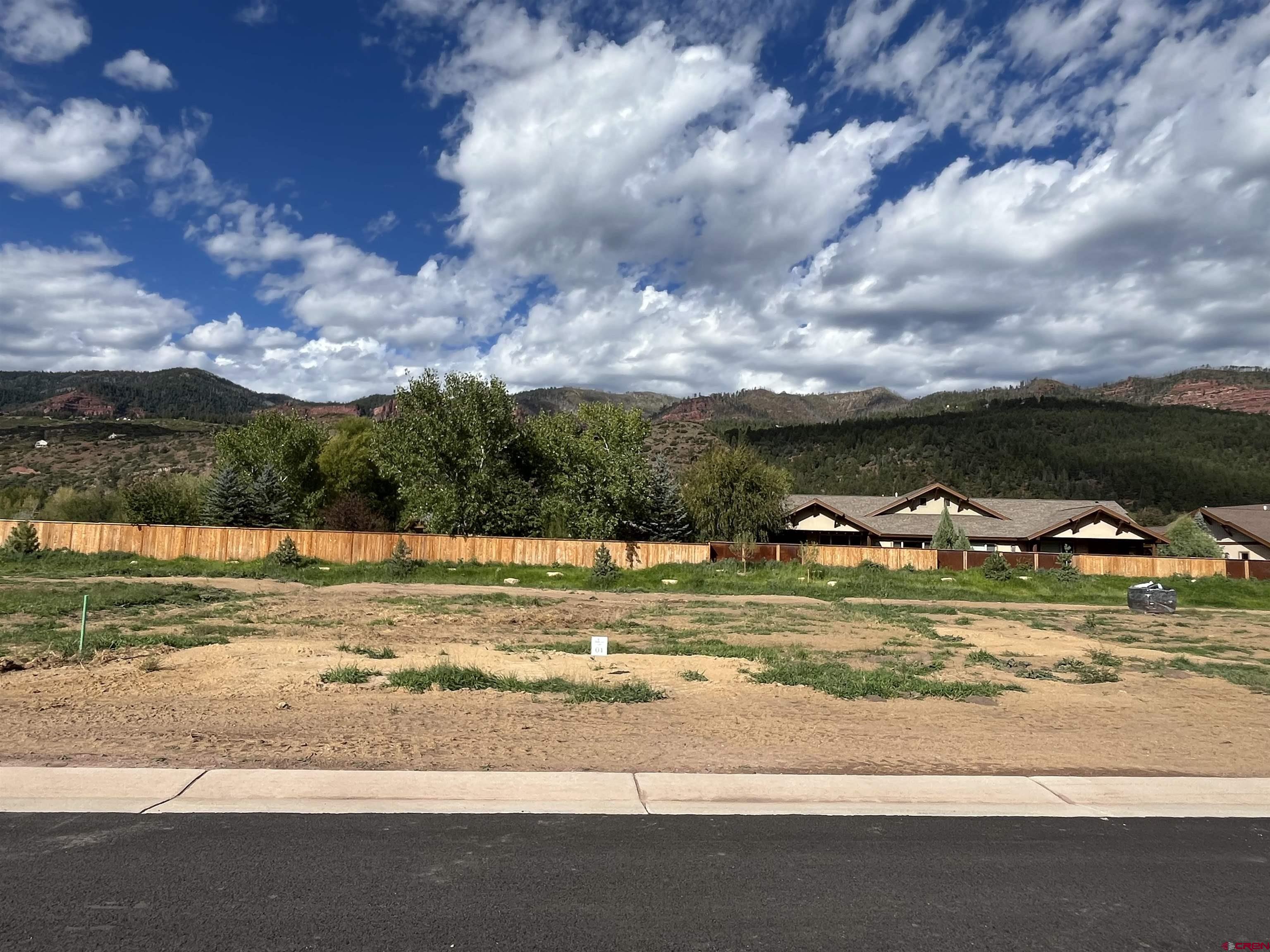 a view of a house a and a big yard