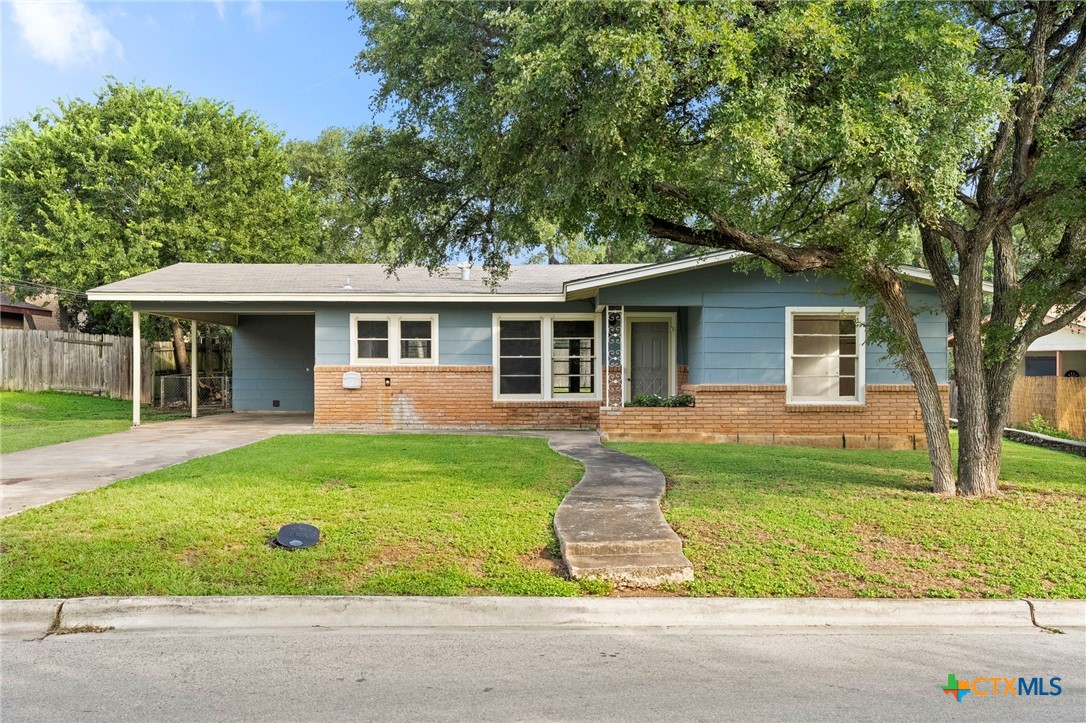 front view of a house and a yard