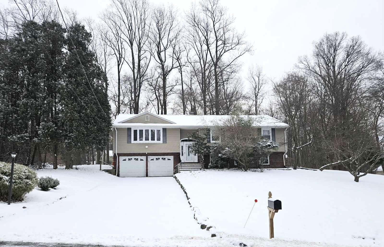 Raised ranch featuring a garage