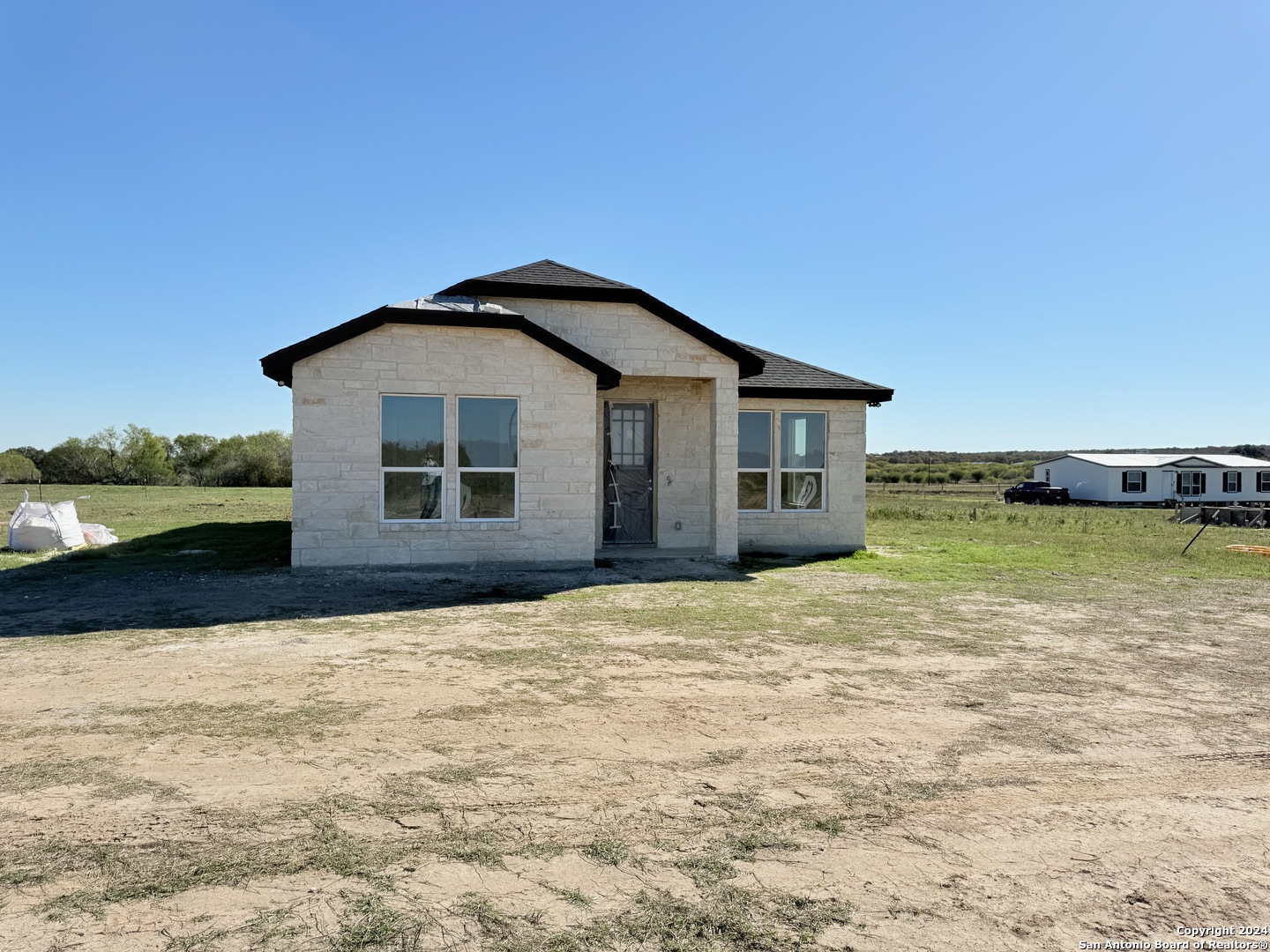 a house with yard in front of it