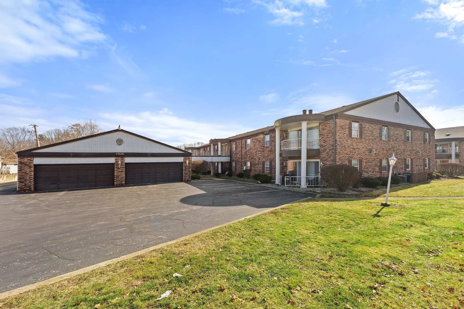 a view of a house with a backyard and a patio