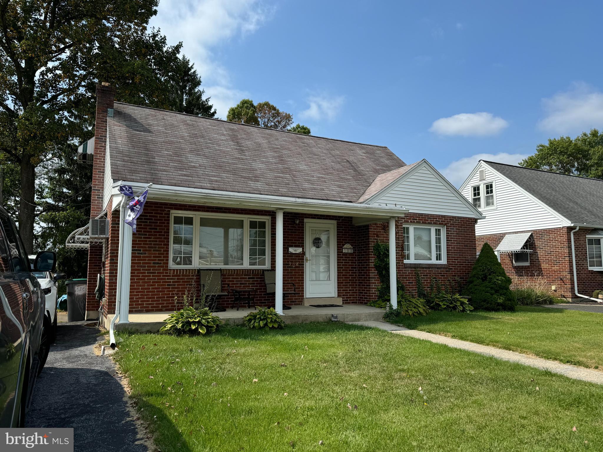 front view of a house with a yard