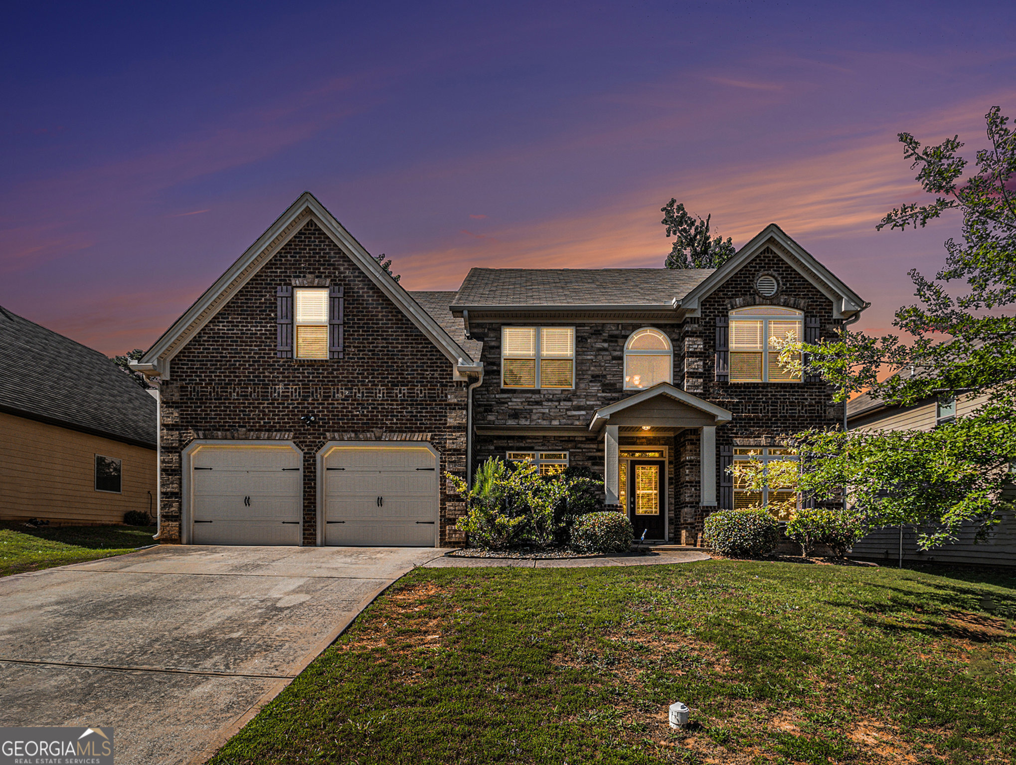 a front view of a house with a yard