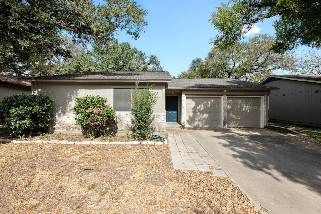 front view of a house with a yard