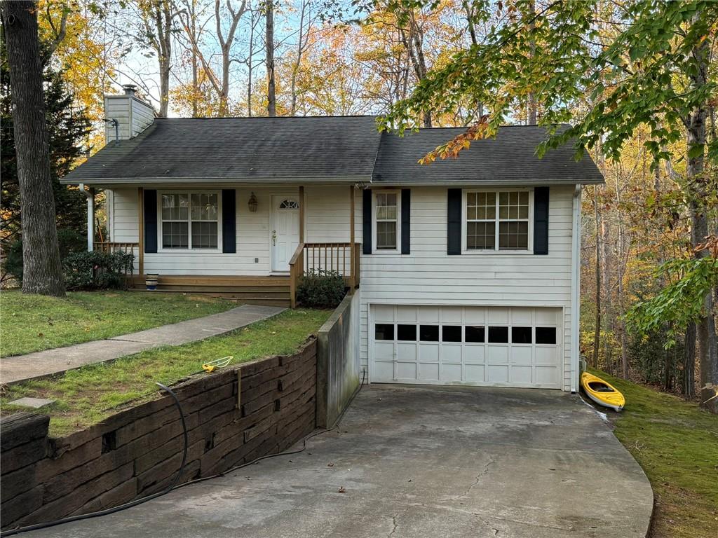 a view of a house with a yard and sitting area