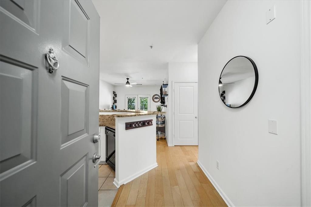 a view of kitchen with a refrigerator and a stove