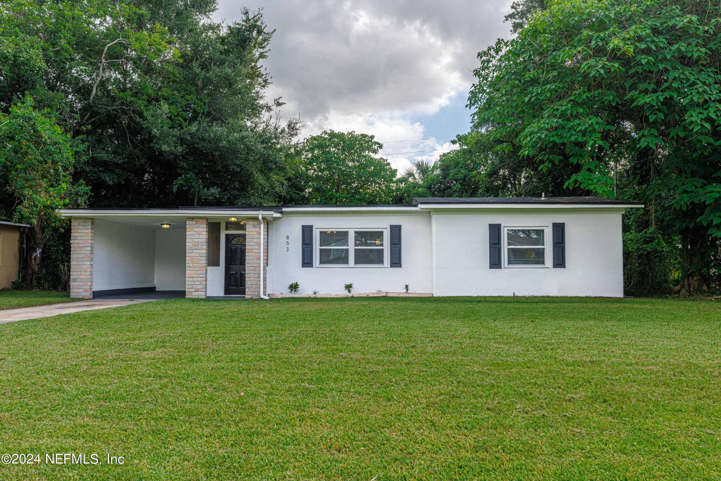 front view of a house and a yard