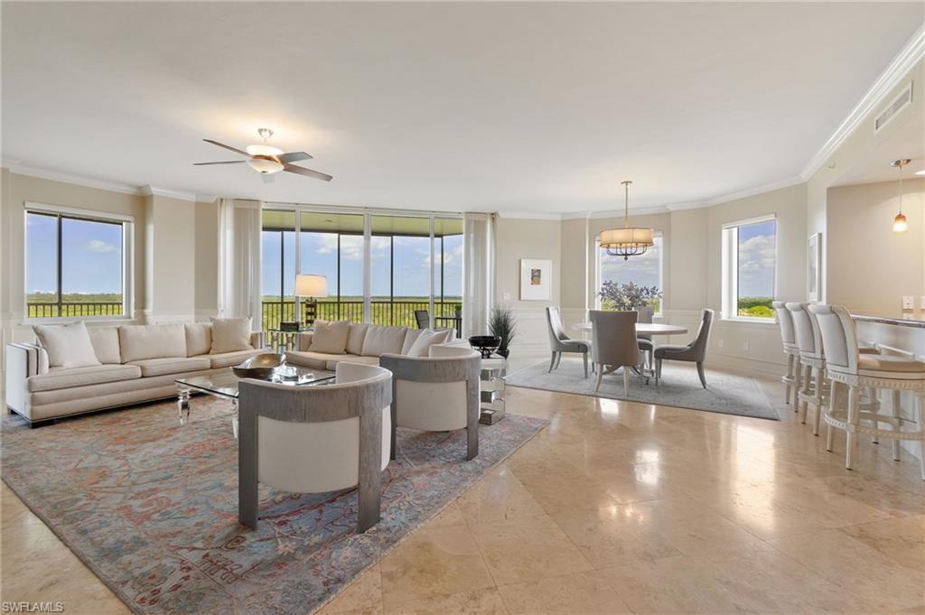 a living room with furniture and a table