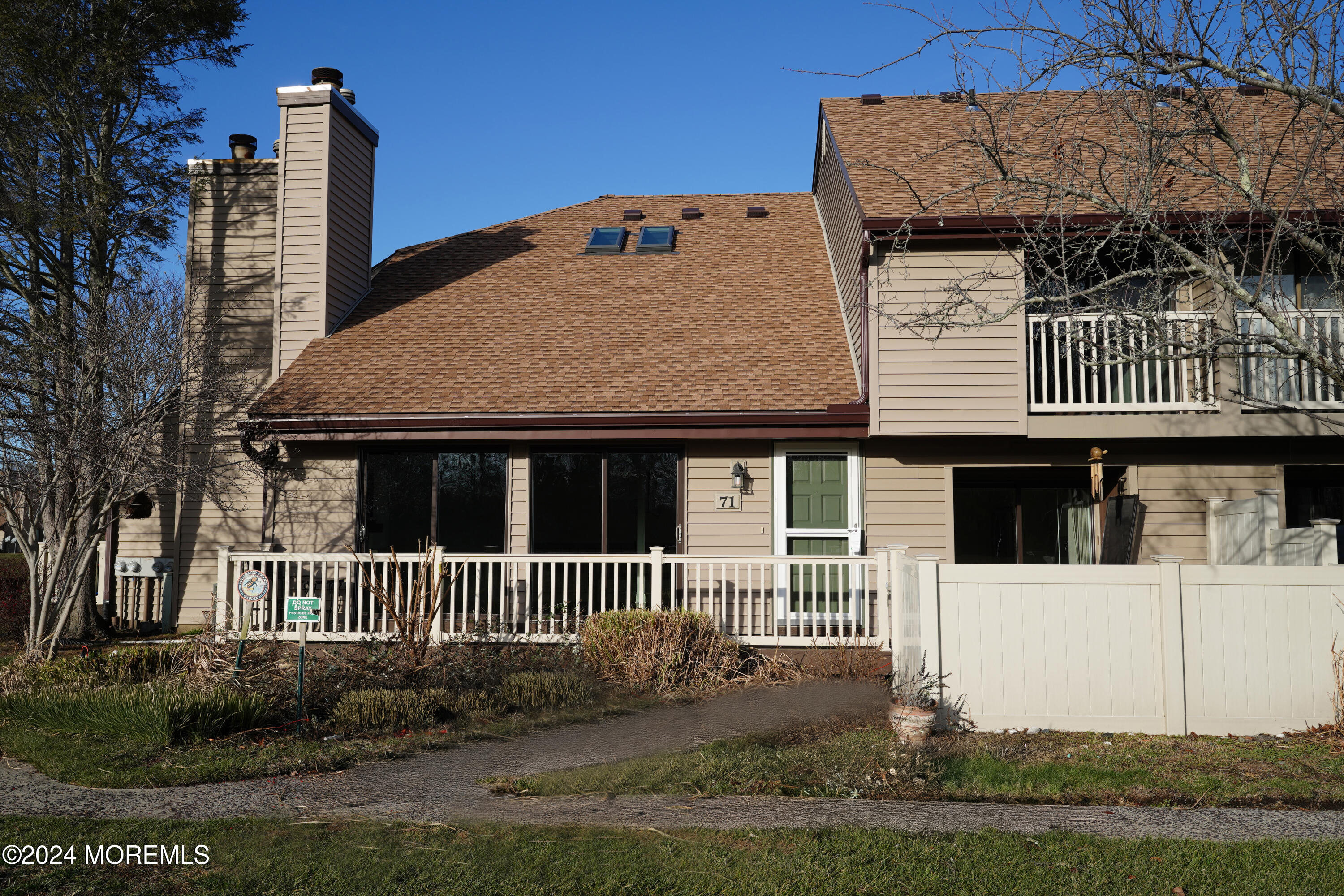 a view of a house with a fence