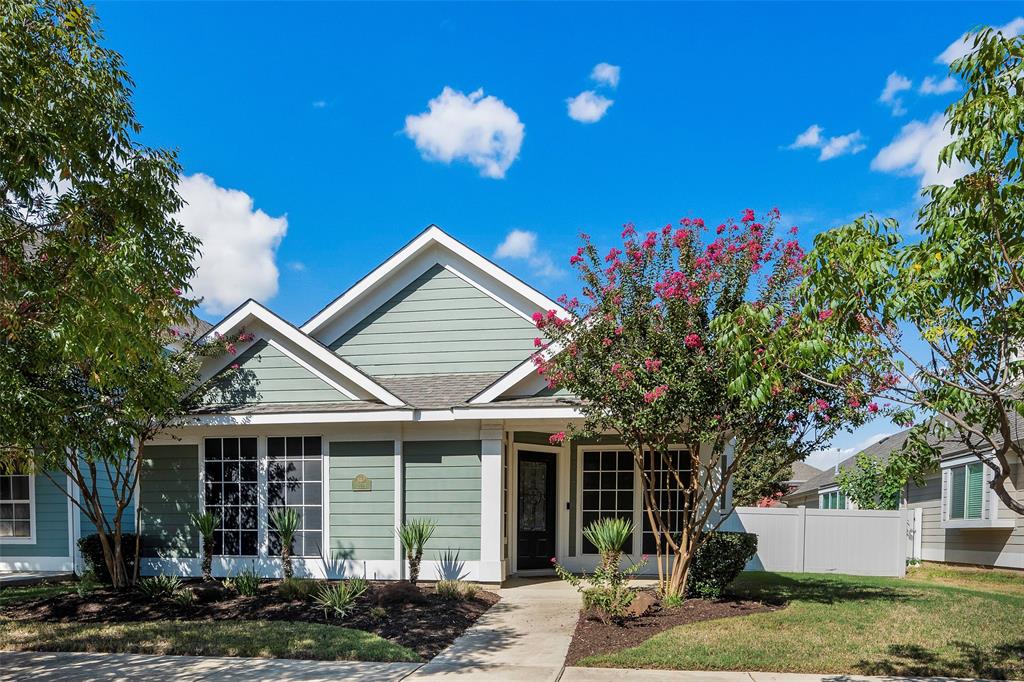 a view of a house with a yard and tree s