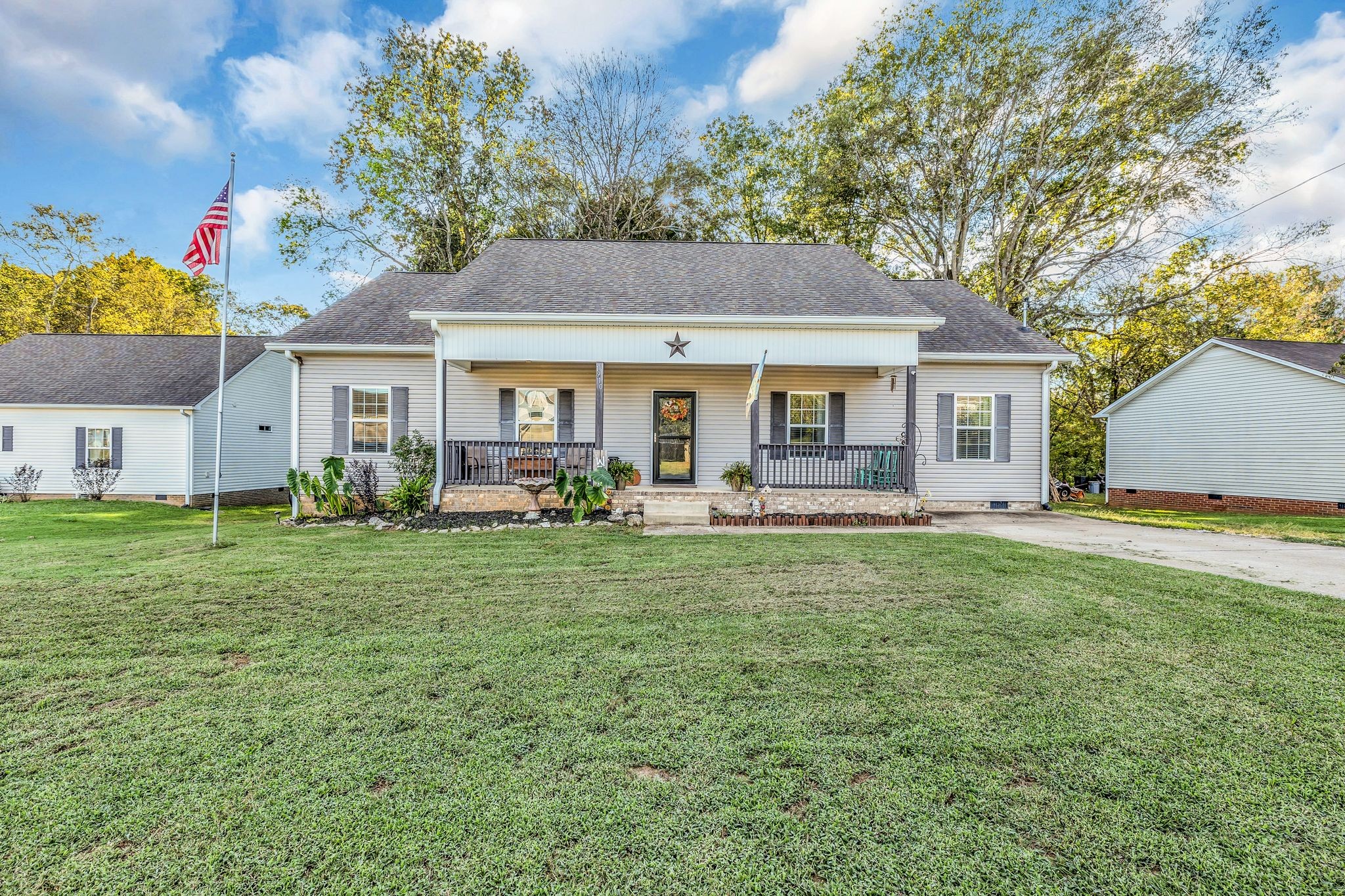 a front view of house with yard and outdoor seating