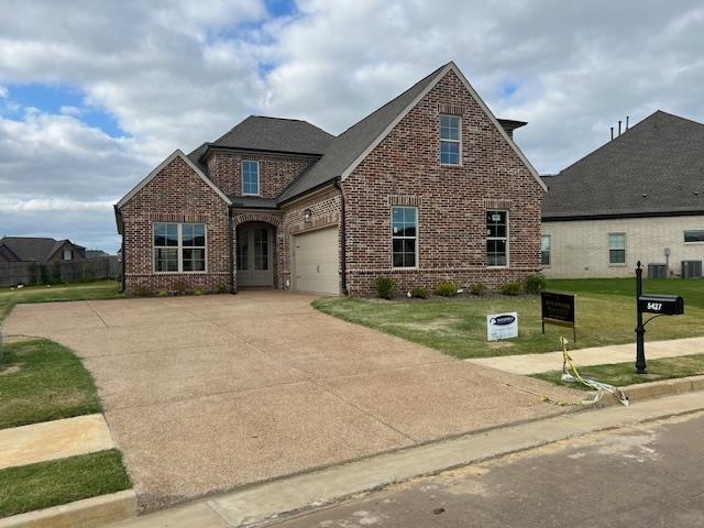 a front view of a house with garage