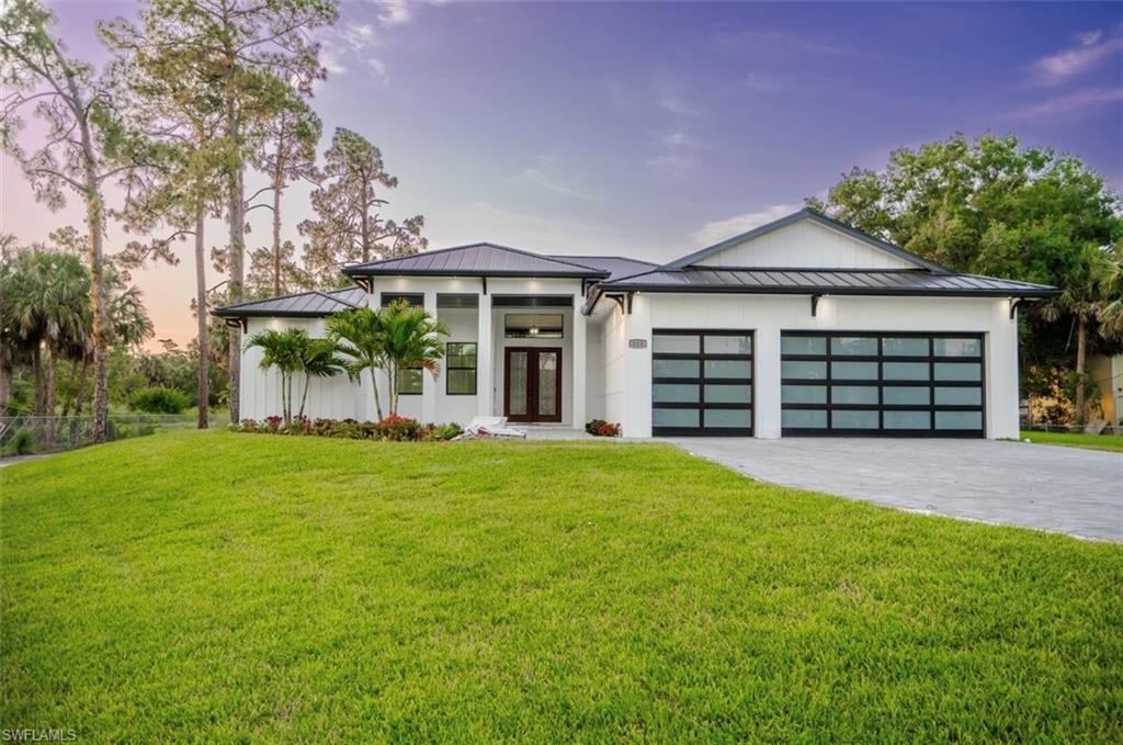 front view of a house with a yard