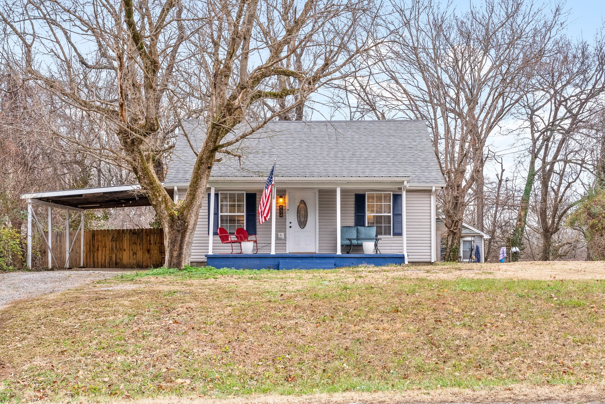 a view of a house with a large tree