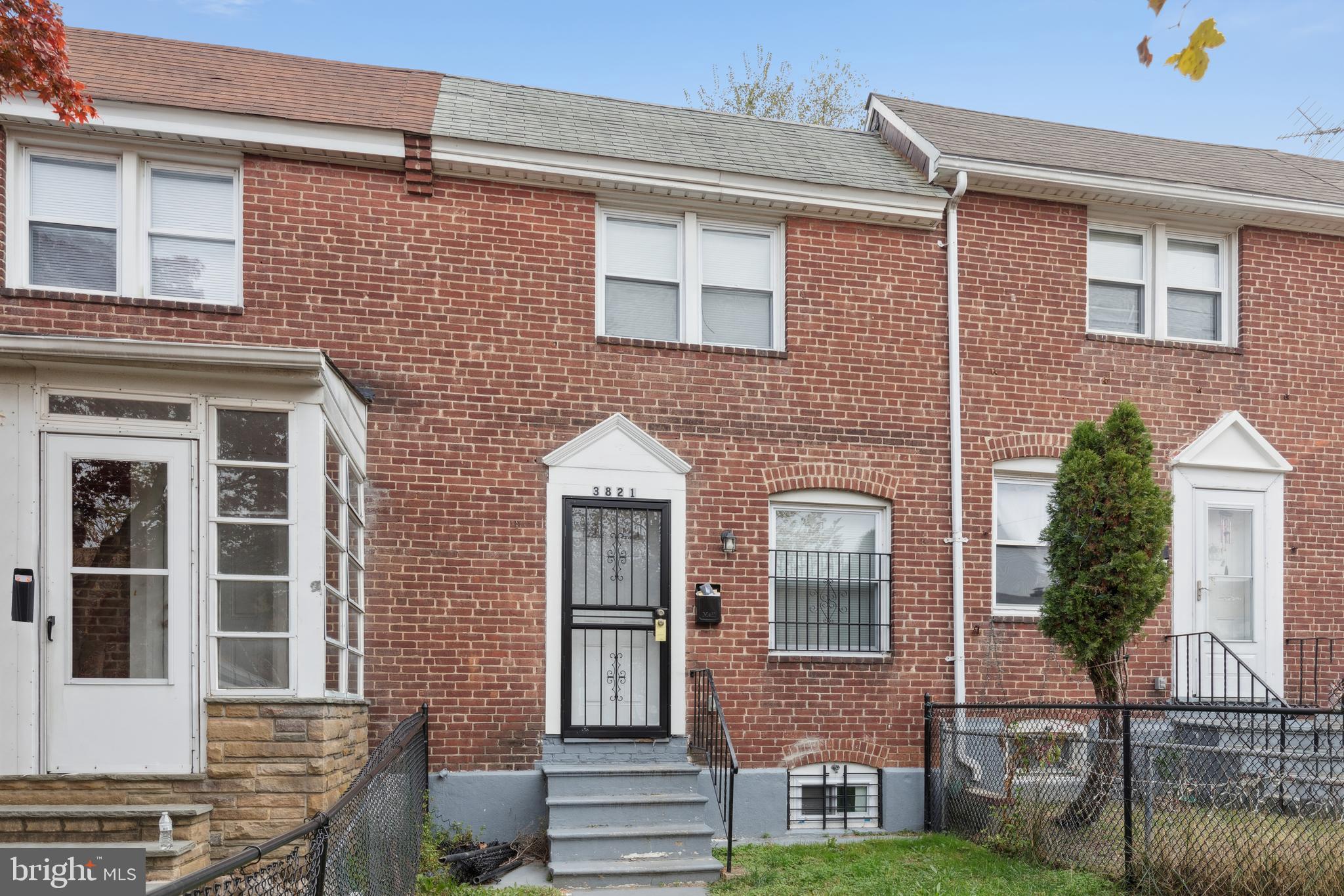 front view of a brick house with a door