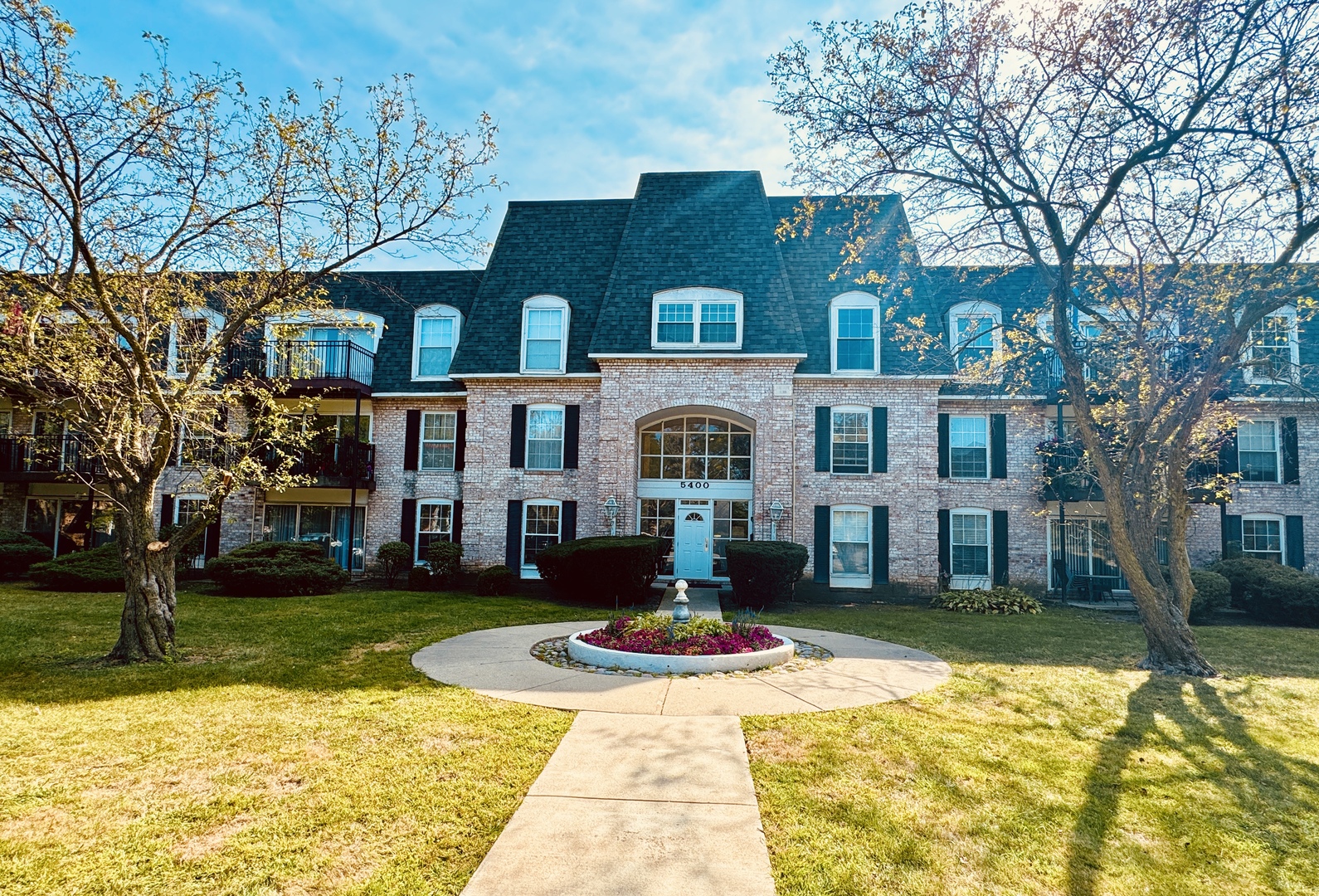 a front view of building with yard