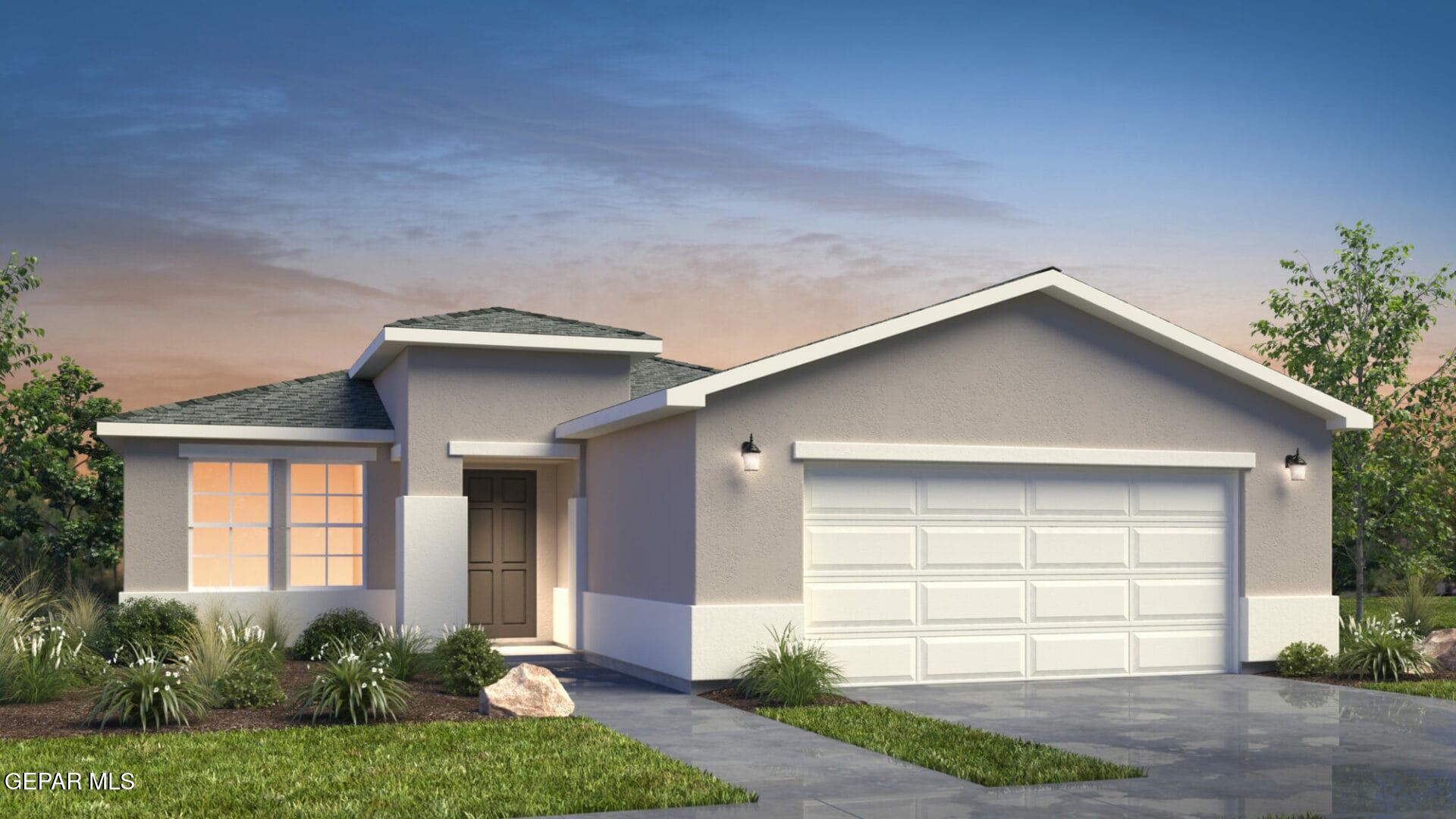 a front view of a house with a yard and garage