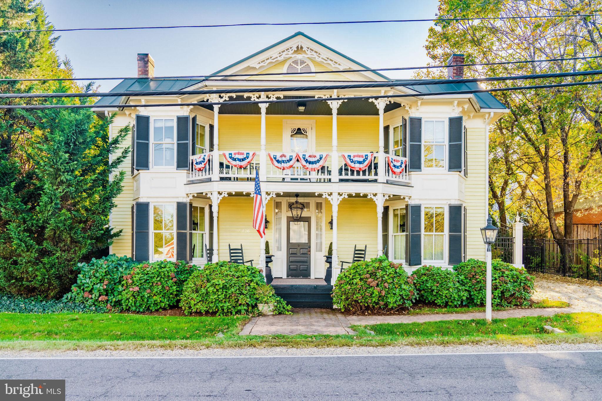 a front view of a building with garden