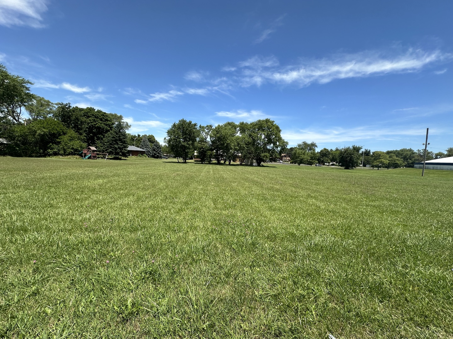 a view of a field with an outdoor space