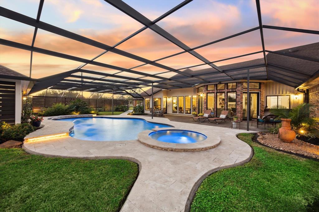 a view of a swimming pool with a patio