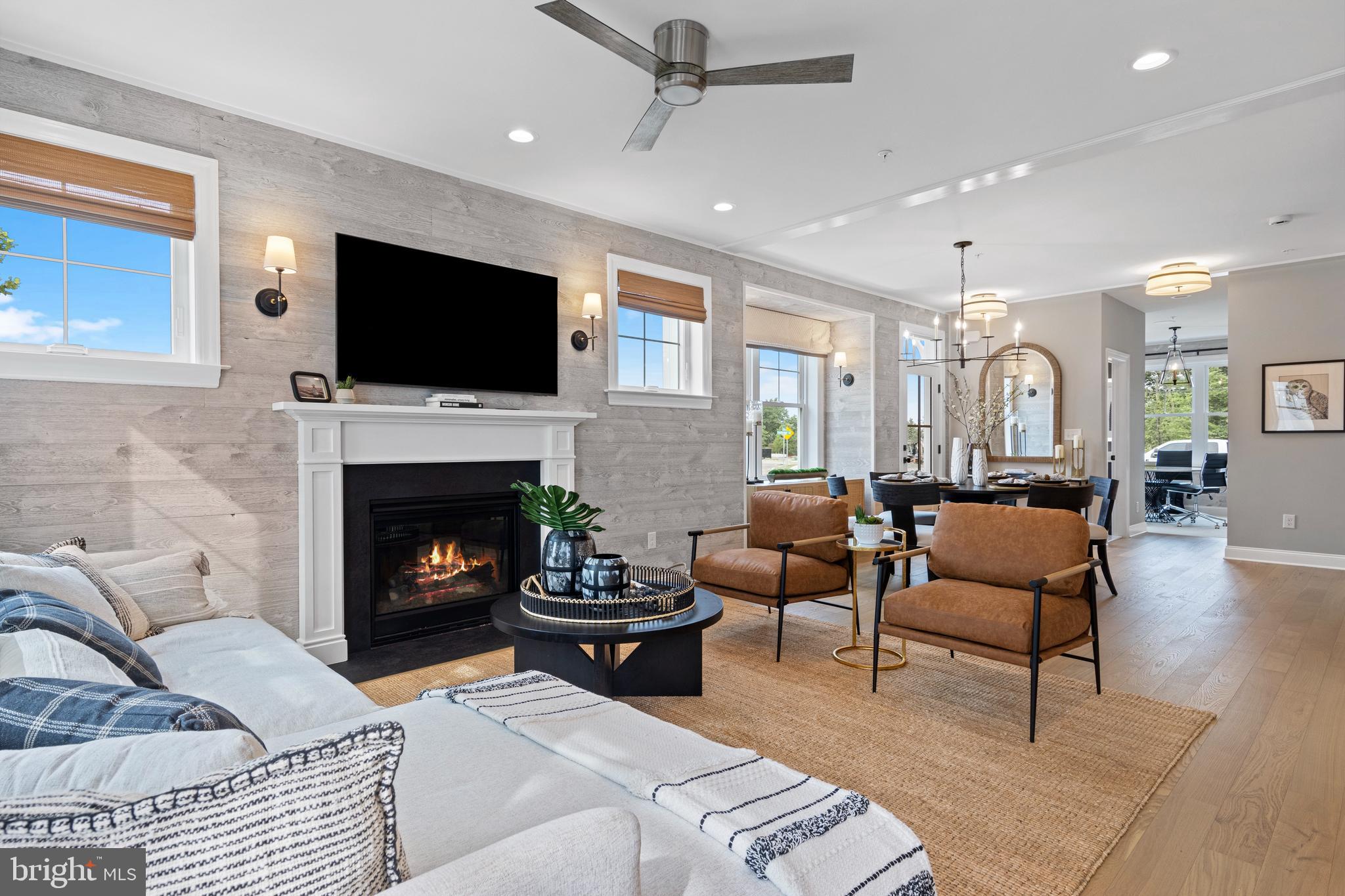 a living room with furniture flat screen tv and a fireplace