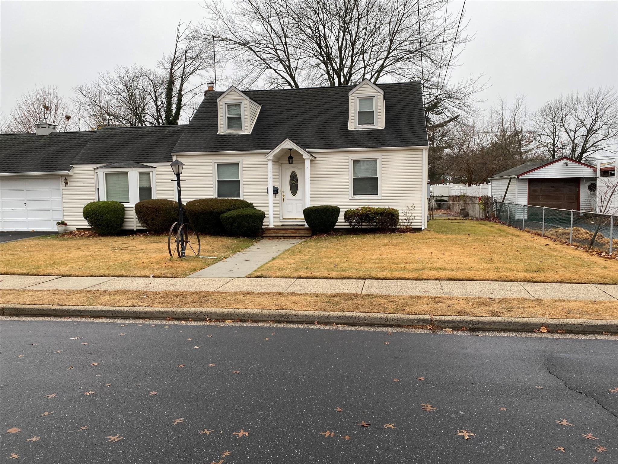 a view of a house with snow on the road