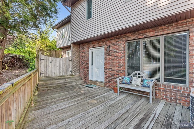 a view of house with deck outdoor seating and yard