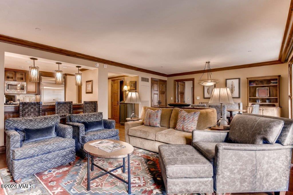 a living room with furniture and a table