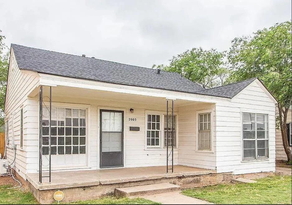 a front view of a house with a garage