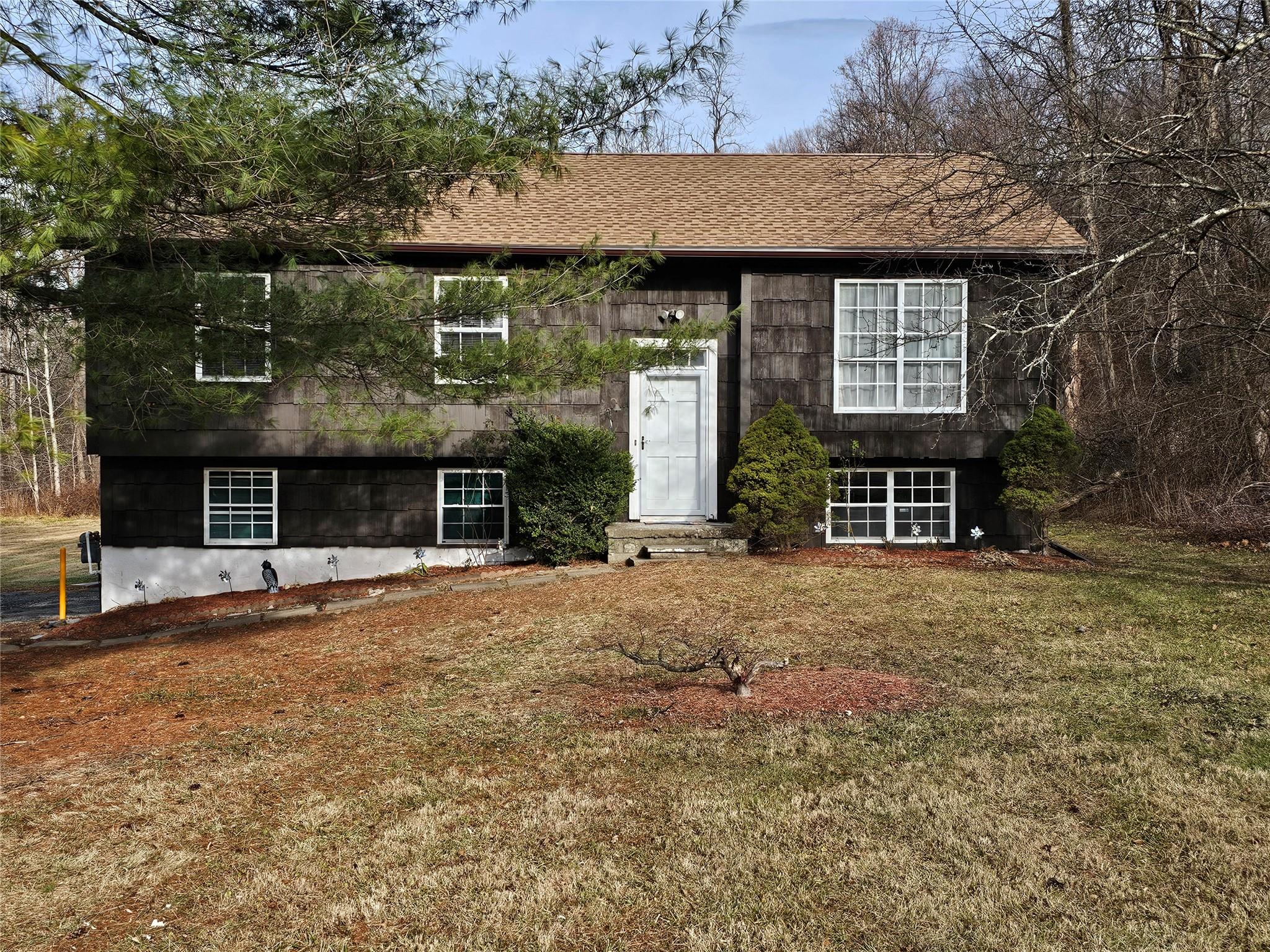 a front view of a house with a yard