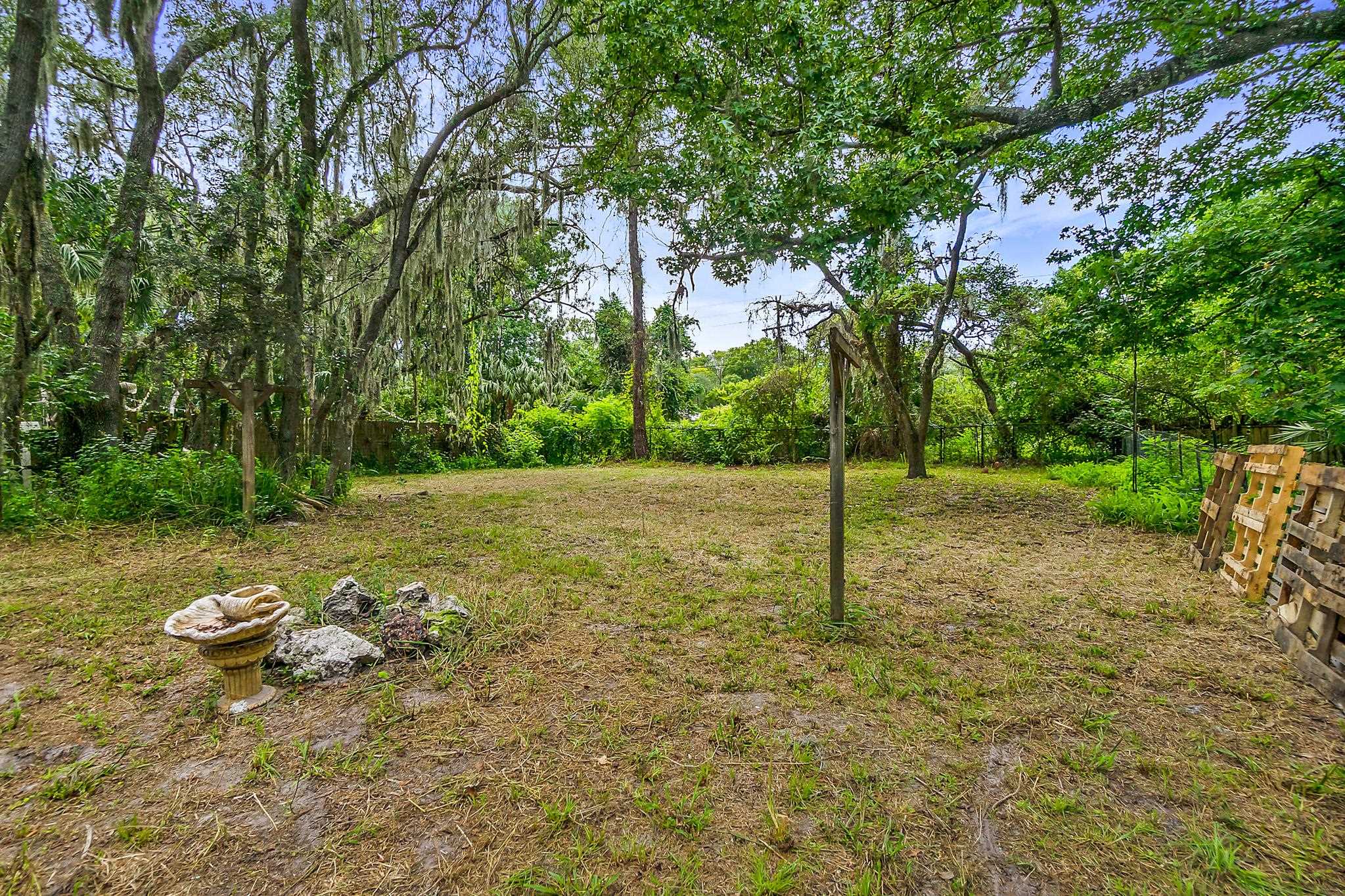 a backyard of a house with lots of green space