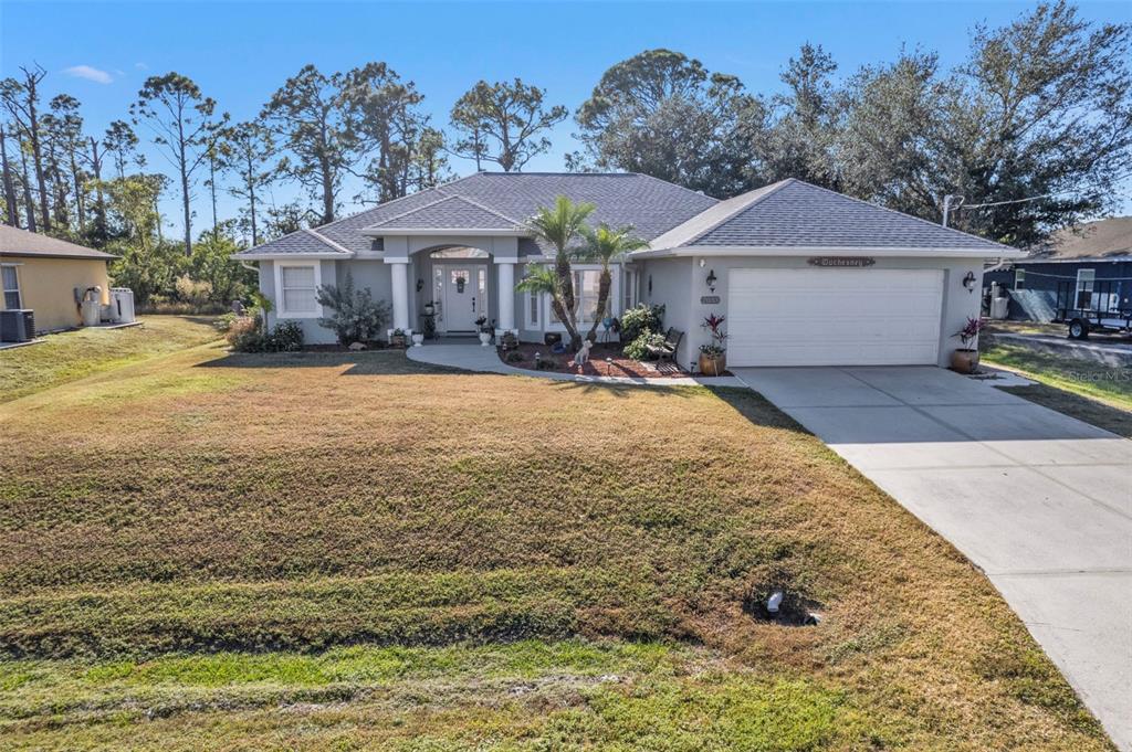 a front view of a house with yard patio and fire pit