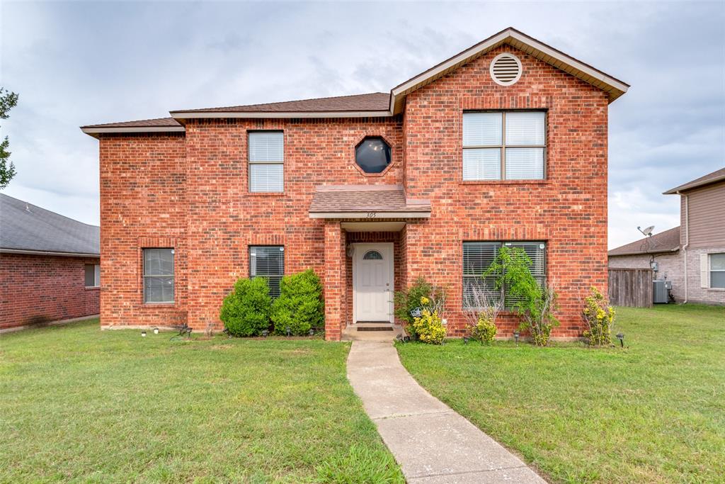 front view of a house with a yard