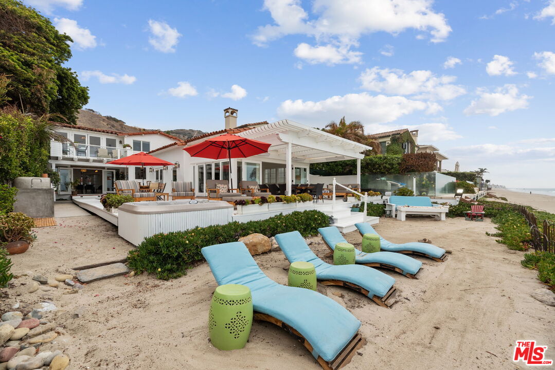 a view of a patio with swimming pool table and chairs