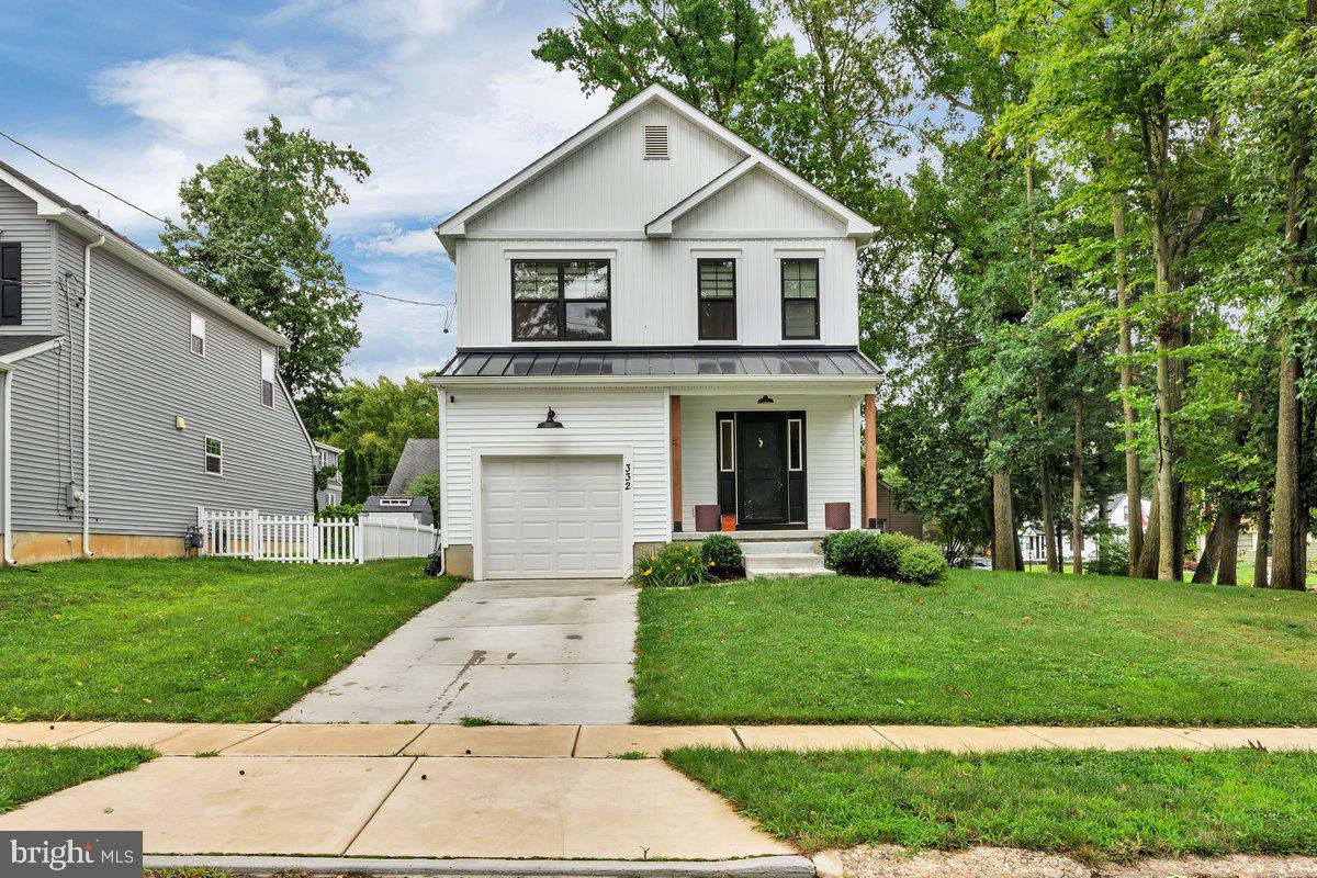 a view of a yard in front view of a house