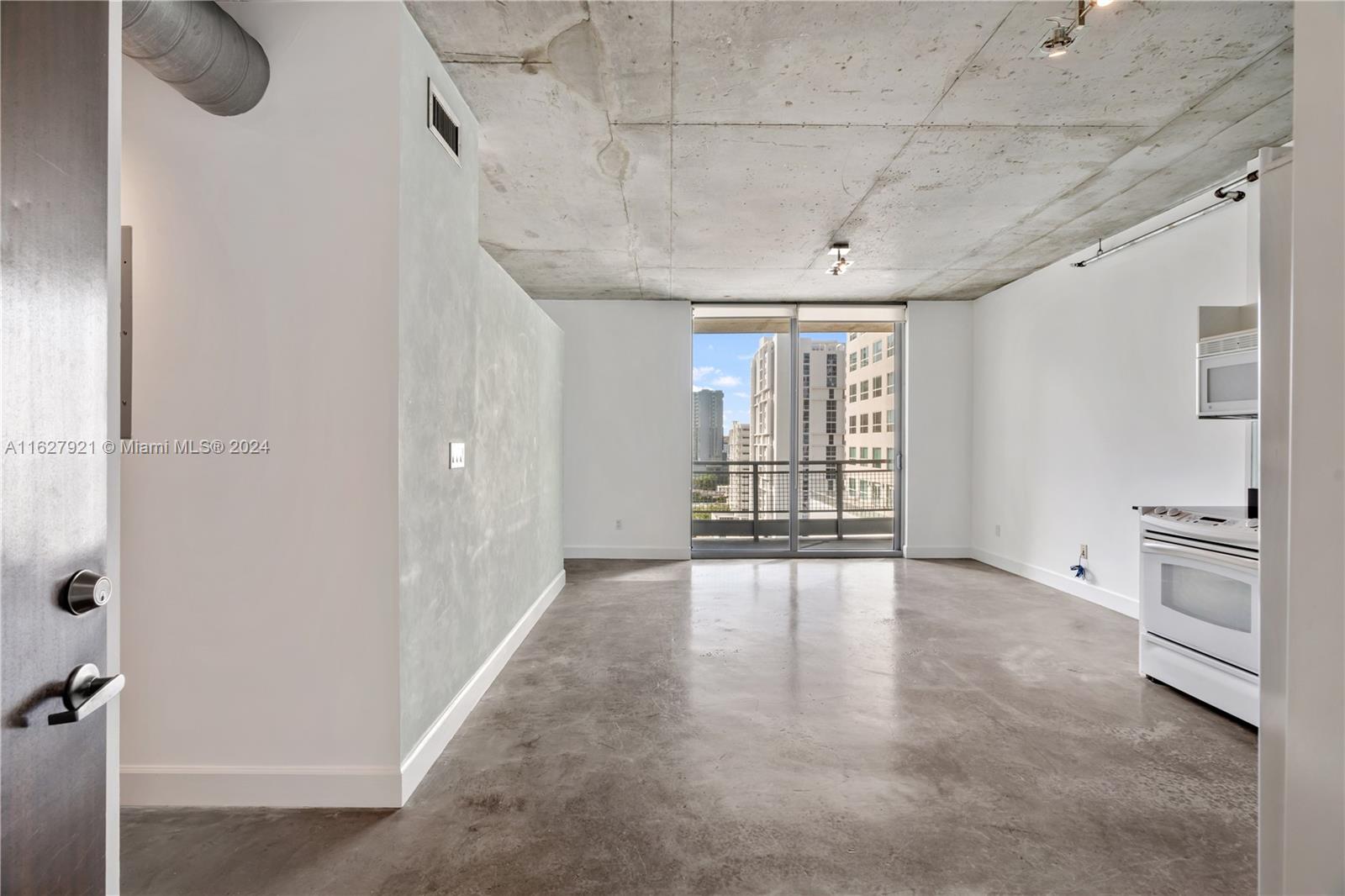 a view of an empty room with a window