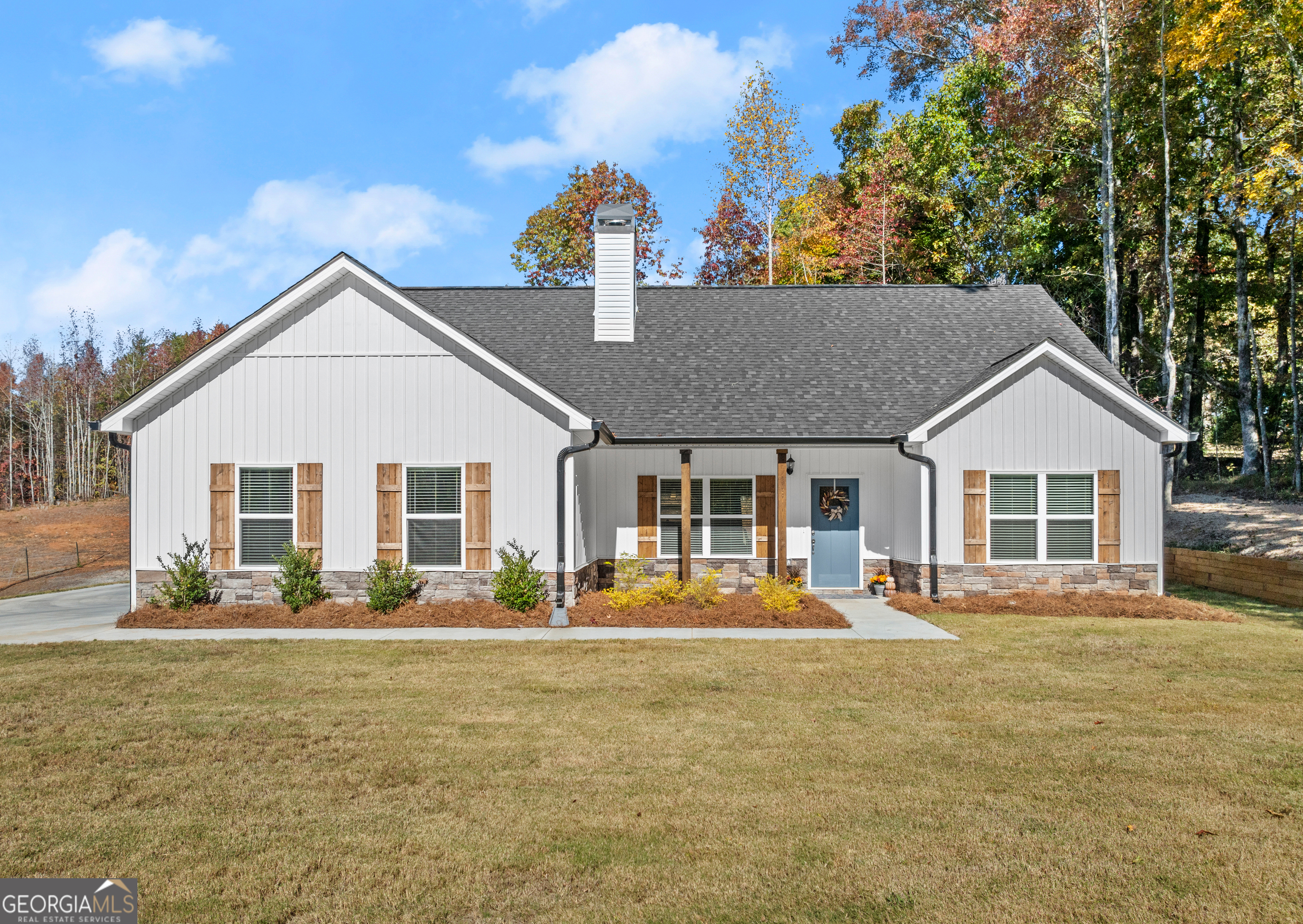 a front view of a house with a yard