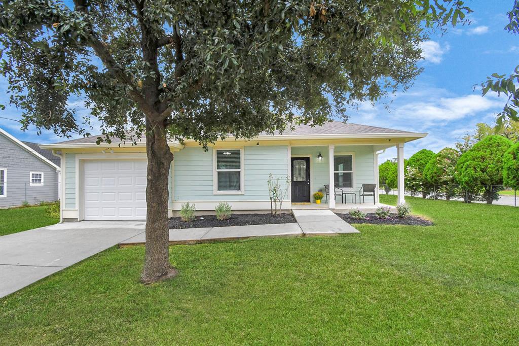 front view of a house with a yard