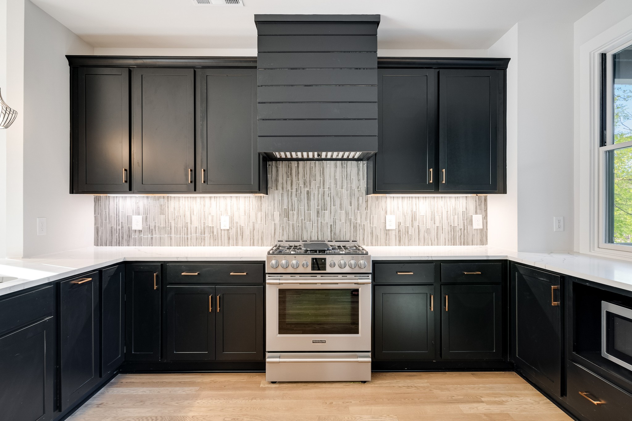 a kitchen with a stove and a sink