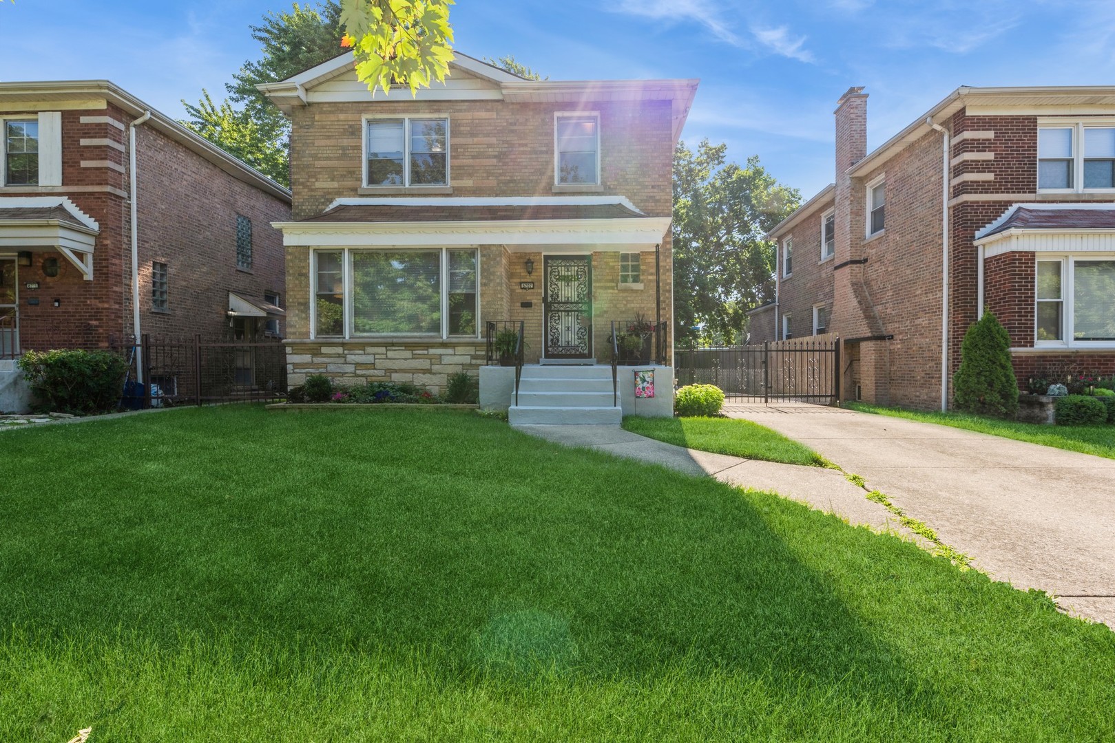 a view of a house with a yard and sitting area