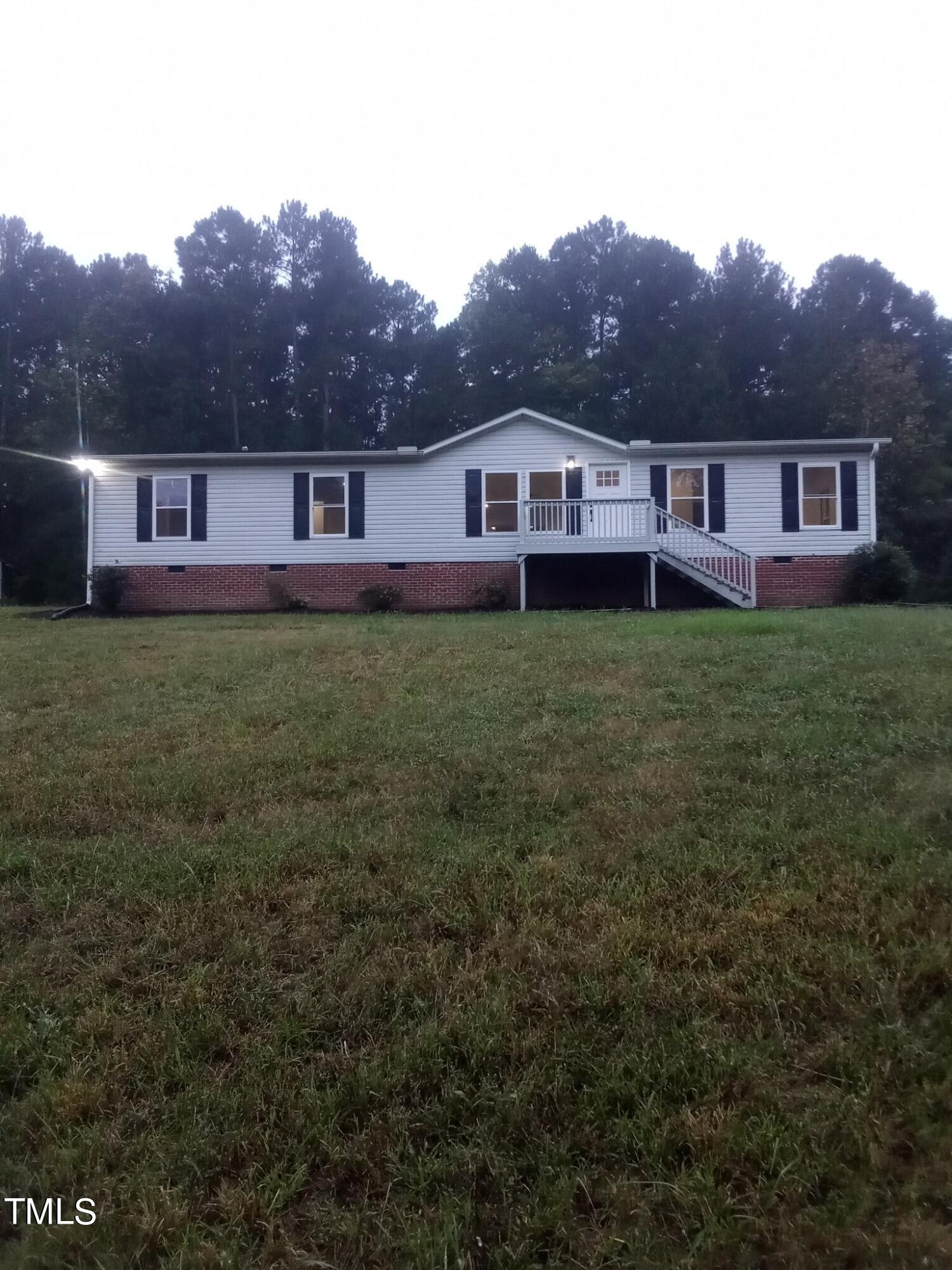 a view of a yard in front of a house