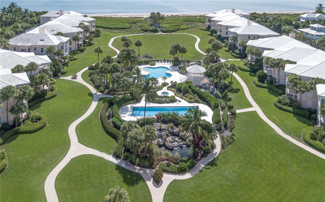 an aerial view of a golf course with parking space