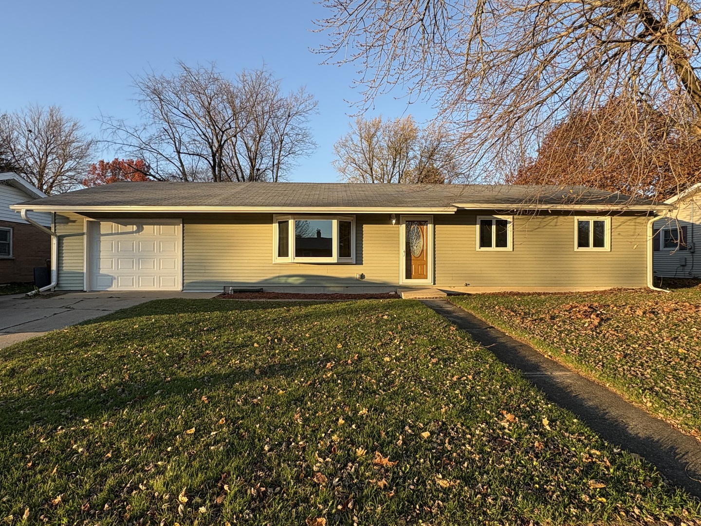 front view of a house with a yard