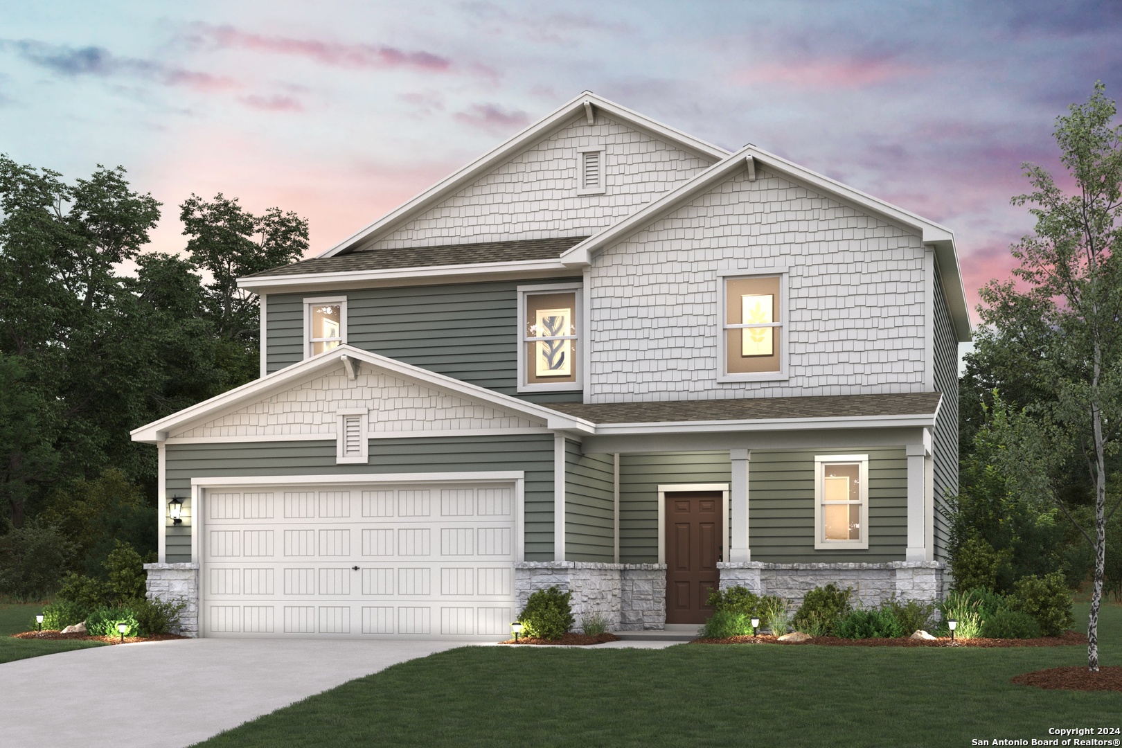 a front view of a house with a yard and garage