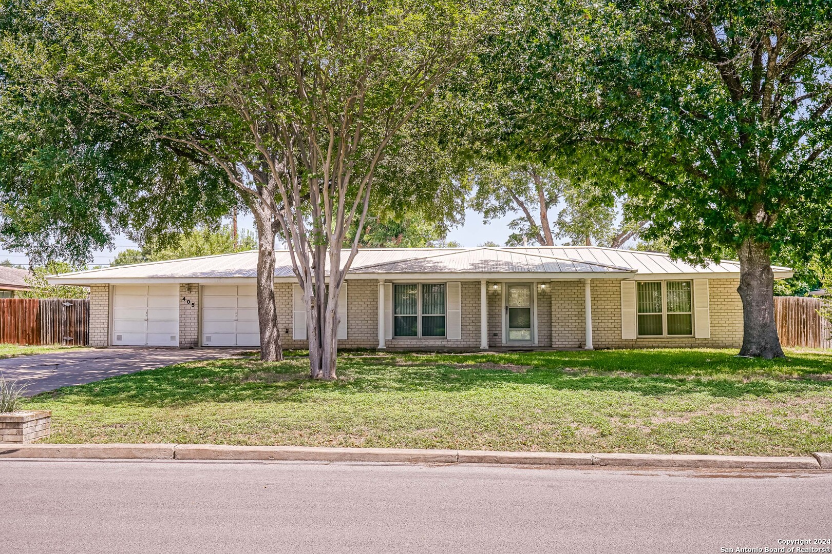 front view of a house with a small yard