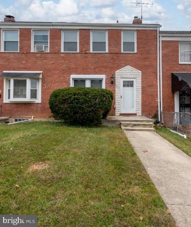 front view of a house with a yard